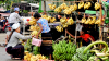 Woman buying bananas 